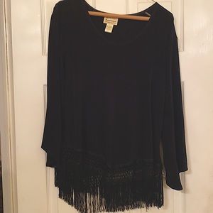 Black blouse with fringe on the bottom.